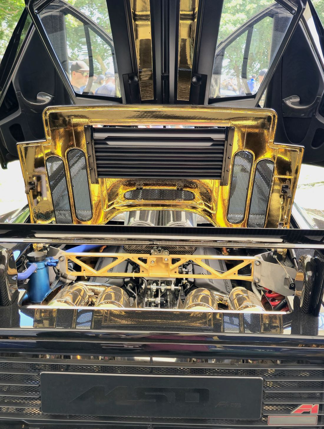 The McLaren F1 engine bay lined with gold foil above the BMW V12 engine