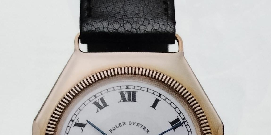 An early Rolex Oyster wristwatch from 1926 with an octagonal gold case and a white dial
